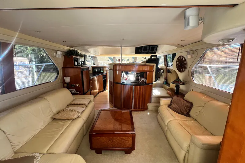 Slide: The Image of Luxurious interior of 2003 Carver 450 Voyager Pilothouse with leather seating and wood accents. - 9