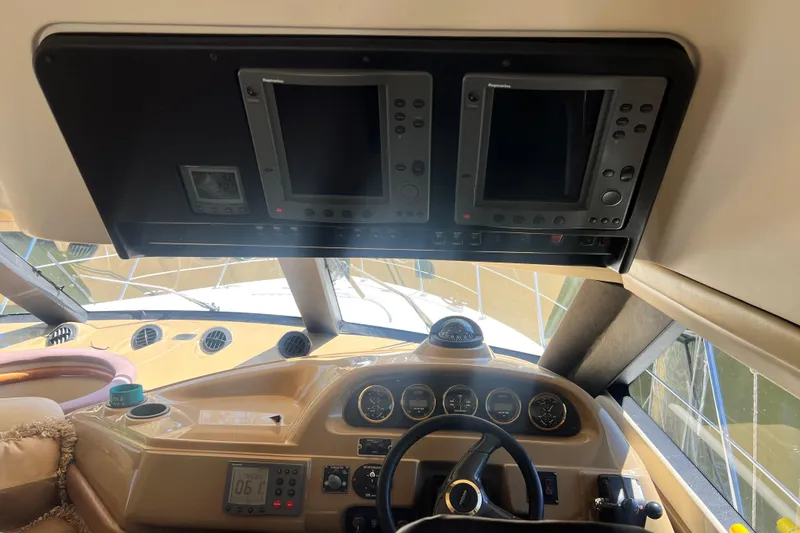 Slide: The Image of Interior helm of 2003 Carver 450 Voyager Pilothouse with navigation instruments. - 14