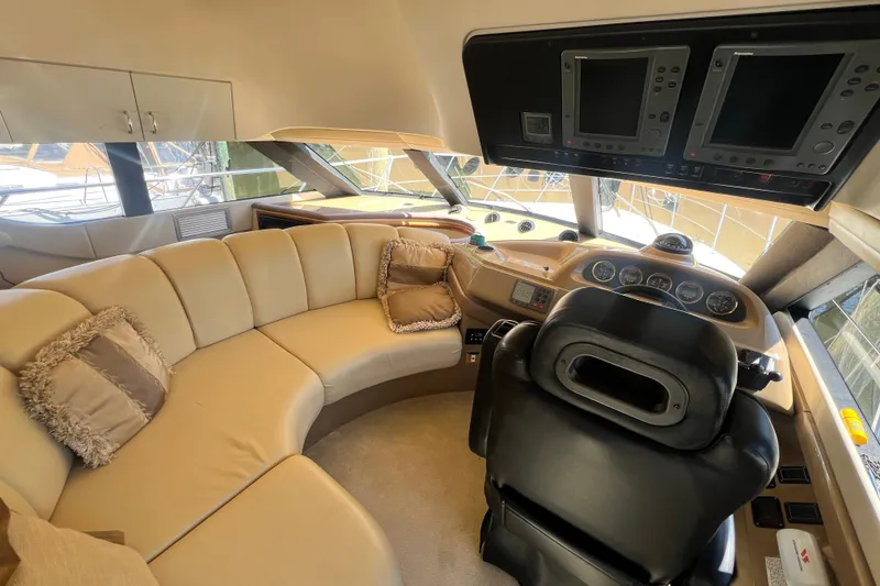 Slide: The Image of Luxurious interior of 2003 Carver 450 Voyager Pilothouse with plush seating and advanced navigation controls. - 17