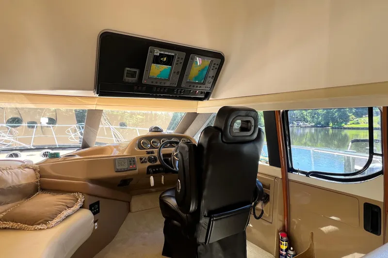 Slide: The Image of Interior of 2003 Carver 450 Voyager Pilothouse with navigation screens and captain's chair. - 20