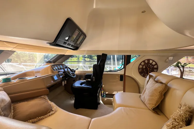Slide: The Image of Luxurious interior of 2003 Carver 450 Voyager Pilothouse with plush seating and modern helm. - 18