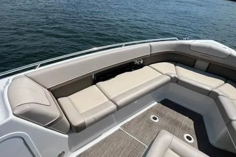 Slide: The Image of 2016 Formula 350 Crossover Bowrider I/O with spacious seating on calm water. - 10