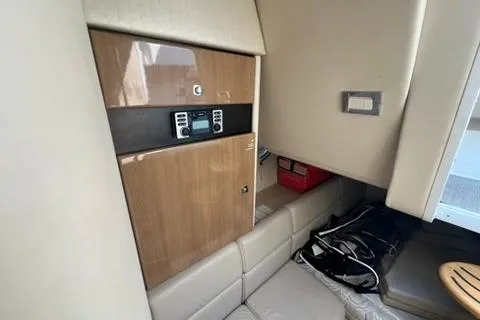 Slide: The Image of Interior of 2016 Formula 350 Crossover Bowrider I/O with seating and storage. - 23