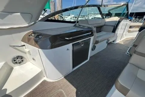 Slide: The Image of 2016 Formula 350 Crossover Bowrider I/O interior with seating and storage. - 25
