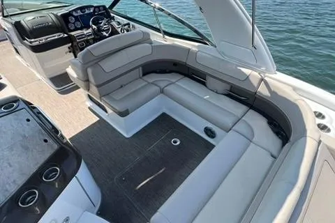 Slide: The Image of 2016 Formula 350 Crossover Bowrider I/O with spacious seating and modern dashboard on water. - 18
