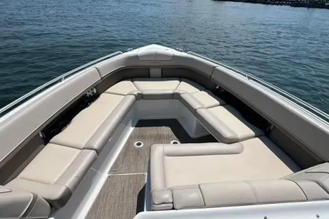 Slide: The Image of 2016 Formula 350 Crossover Bowrider I/O with spacious seating on calm water. - 8