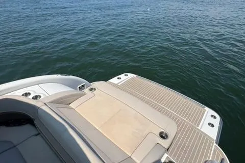Slide: The Image of 2016 Formula 350 Crossover Bowrider I/O on water, featuring spacious deck and seating. - 16