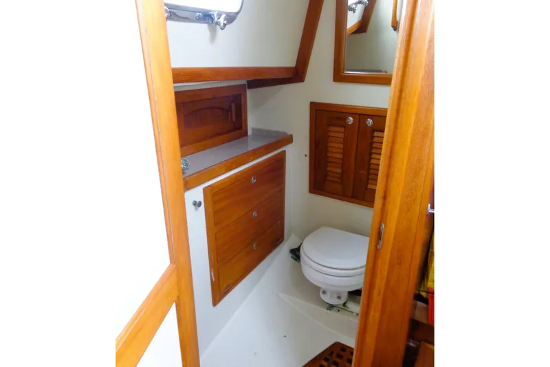 Slide: The Image of Bathroom interior of 2008 Pacific Seacraft 31 yacht with wooden cabinetry and toilet. - 6
