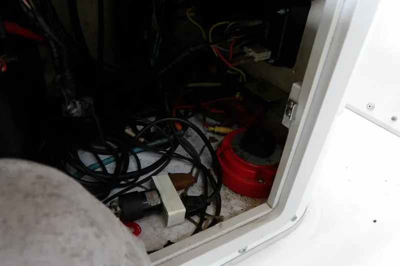 Slide: The Image of Electrical wiring inside a 1997 Boston Whaler Dauntless 13 boat compartment. - 12