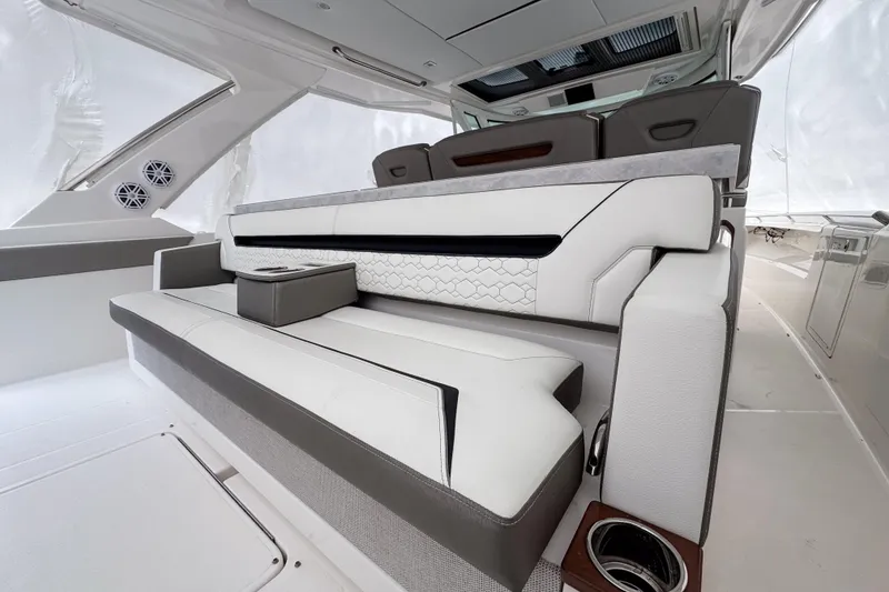 Slide: The Image of Luxurious seating area on a 2022 Tiara Yachts 43 LS, featuring modern design and comfort. - 6