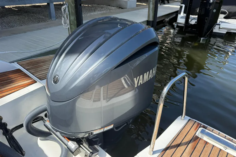 Slide: The Image of Yamaha outboard motor on 2020 Jeanneau Leader 7.5 CC boat at dock. - 23