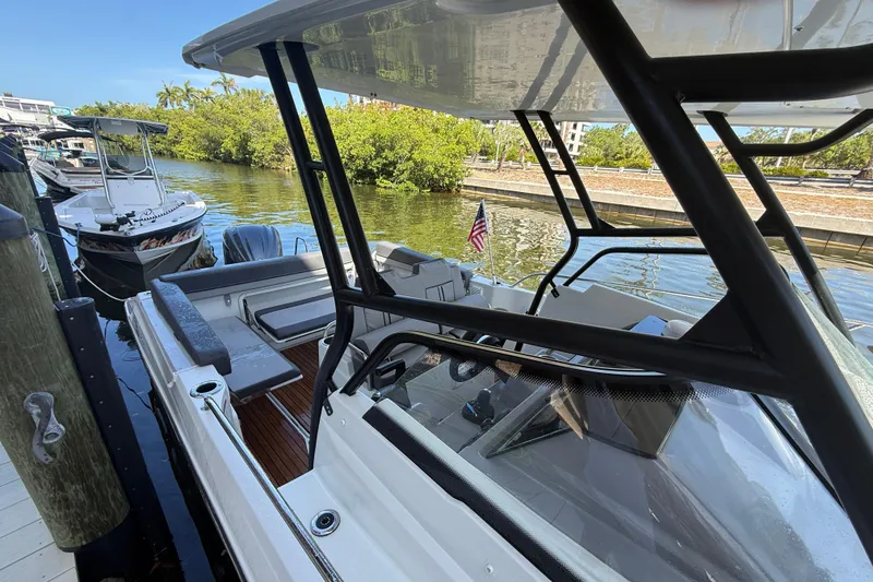 Slide: The Image of 2020 Jeanneau Leader 7.5 CC boat docked by a scenic canal. - 3
