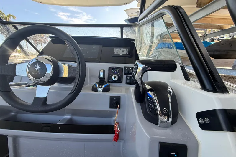 Slide: The Image of Cockpit of 2020 Jeanneau Leader 7.5 CC boat with steering wheel and controls. - 9