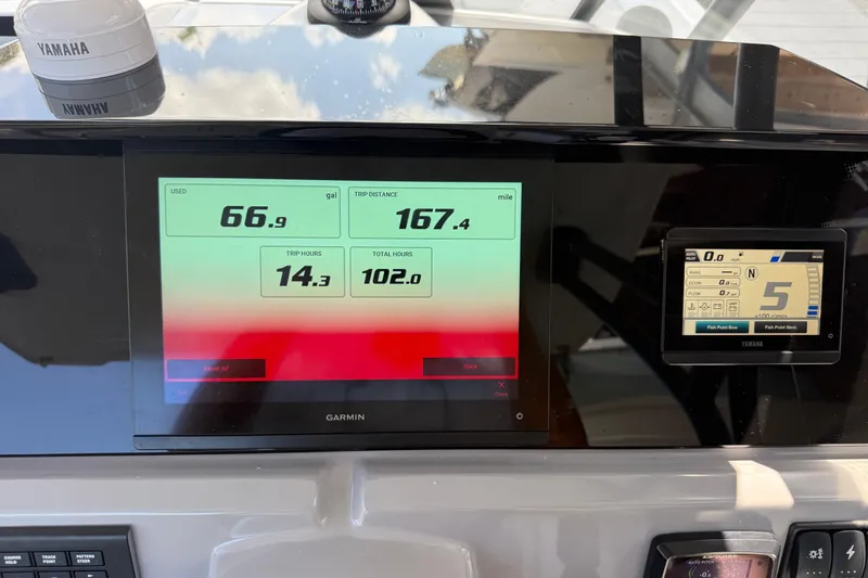 Slide: The Image of Dashboard of a 2020 Jeanneau Leader 7.5 CC boat with Garmin and Yamaha displays. - 11
