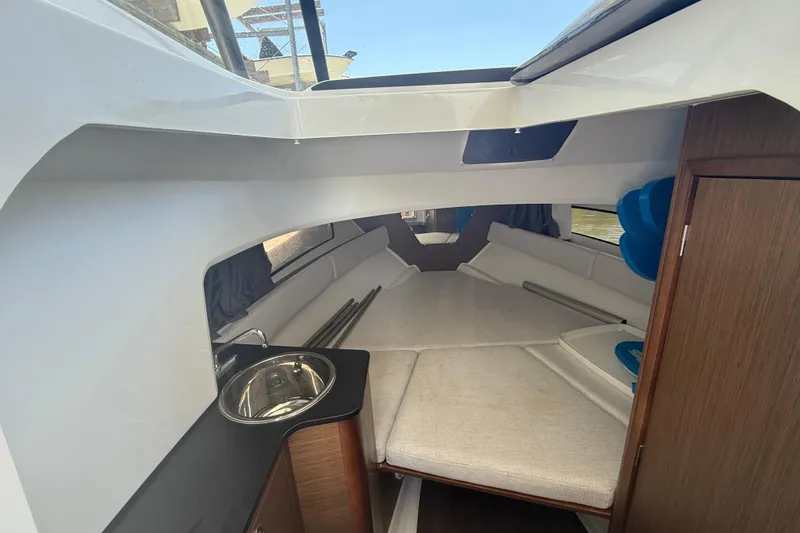 Slide: The Image of Interior cabin of 2020 Jeanneau Leader 7.5 CC with cozy seating and compact sink. - 13