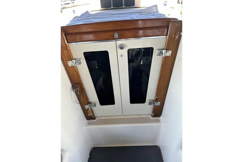 Slide: The Image of Cabin entrance of 2006 Island Packet 440 sailboat with wooden trim and dual doors. - 29