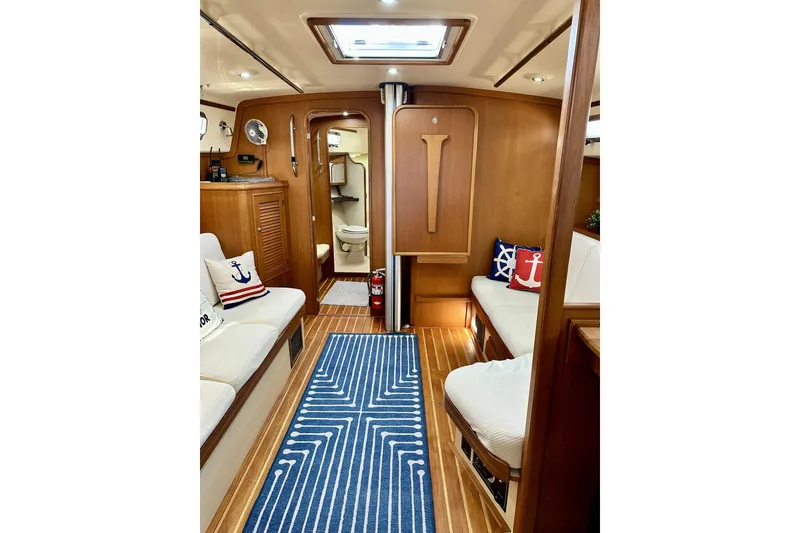Slide: The Image of Interior of 2006 Island Packet 440 yacht with nautical decor and wooden finishes. - 42