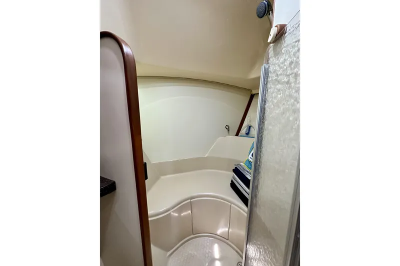 Slide: The Image of Interior of 2006 Island Packet 440 yacht, featuring a compact bathroom with shower. - 50