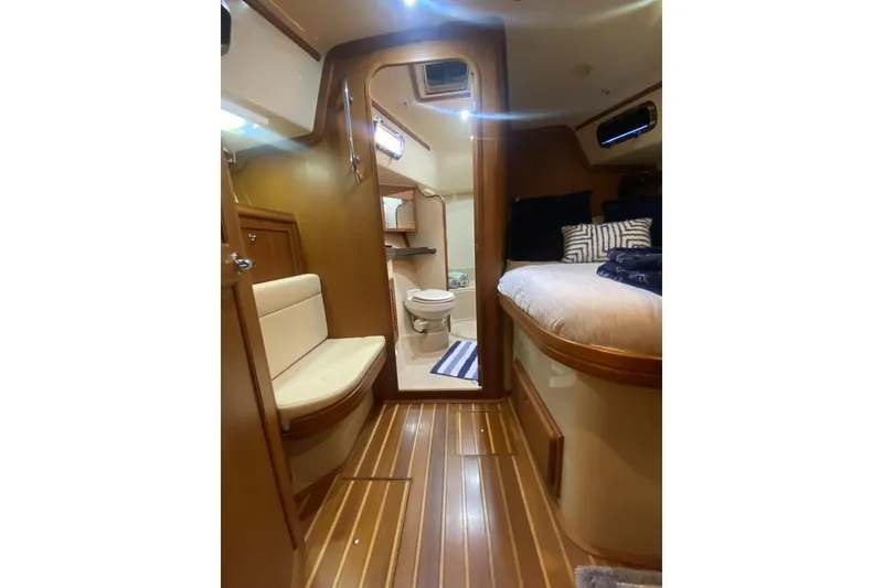 Slide: The Image of Interior of 2006 Island Packet 440 yacht with cozy seating and elegant wood finish. - 57