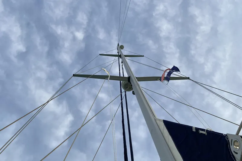 Slide: The Image of Mast of 2006 Island Packet 440 sailboat against a cloudy sky. - 5