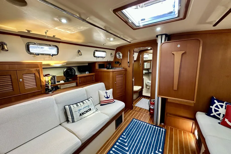 Slide: The Image of Luxurious 2006 Island Packet 440 yacht interior with cozy seating and nautical decor. - 45