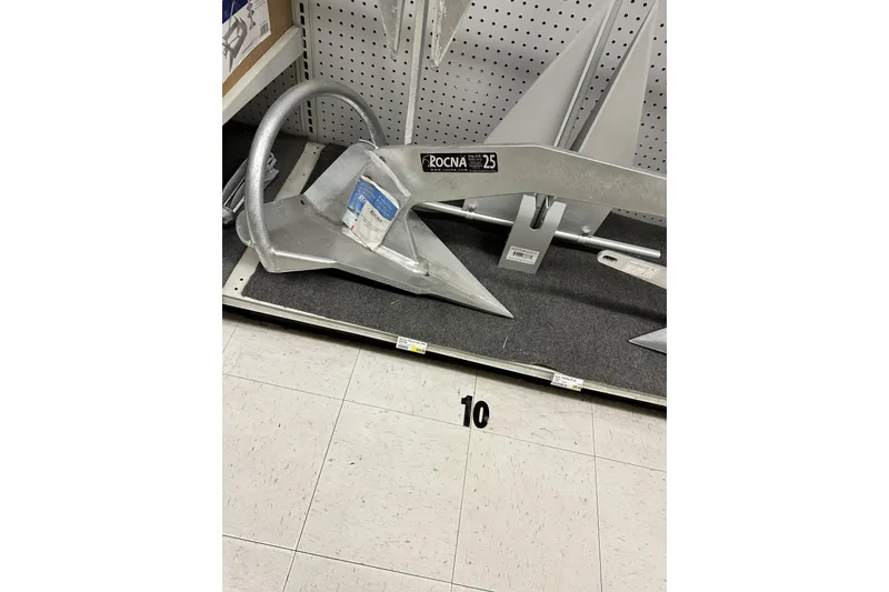 Slide: The Image of Rocna 25 anchor displayed in a store, suitable for Island Packet 440, 2006 model. - 60