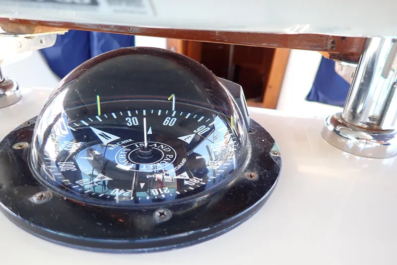 Slide: The Image of Compass on 2006 Island Packet 440 yacht, displaying navigational directions. - 37