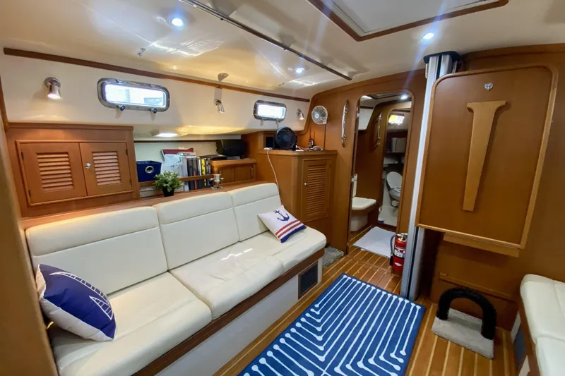 Slide: The Image of Luxurious interior of 2006 Island Packet 440 yacht with cozy seating and nautical decor. - 43