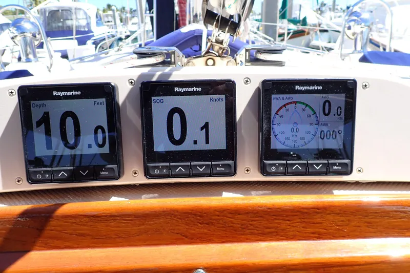 Slide: The Image of Raymarine navigation displays on 2006 Island Packet 440 yacht, showing depth, speed, and wind data. - 30