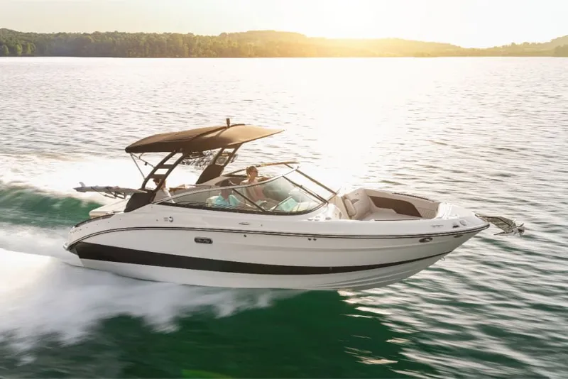 Slide: The Image of A sleek motorboat speeds across the water at sunset. - 0