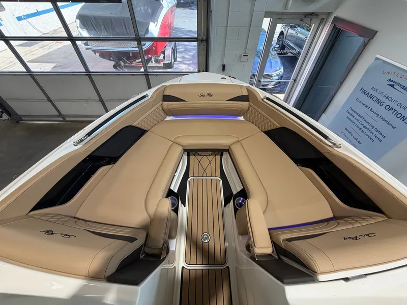 Slide: The Image of The image shows the cockpit of a 2027 Sea Ray SLX 280 with sleek beige upholstery. - 22