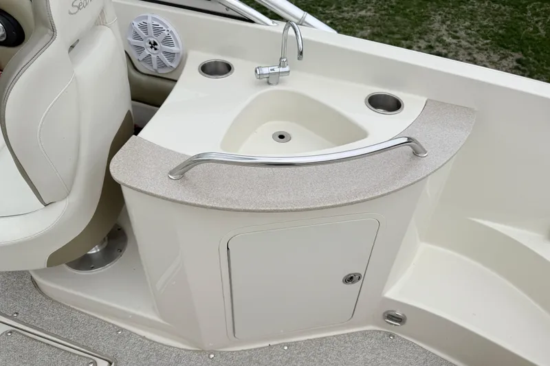 Slide: The Image of 2007 Sea Ray 260 Sundeck boat interior with sink and seating area. - 5