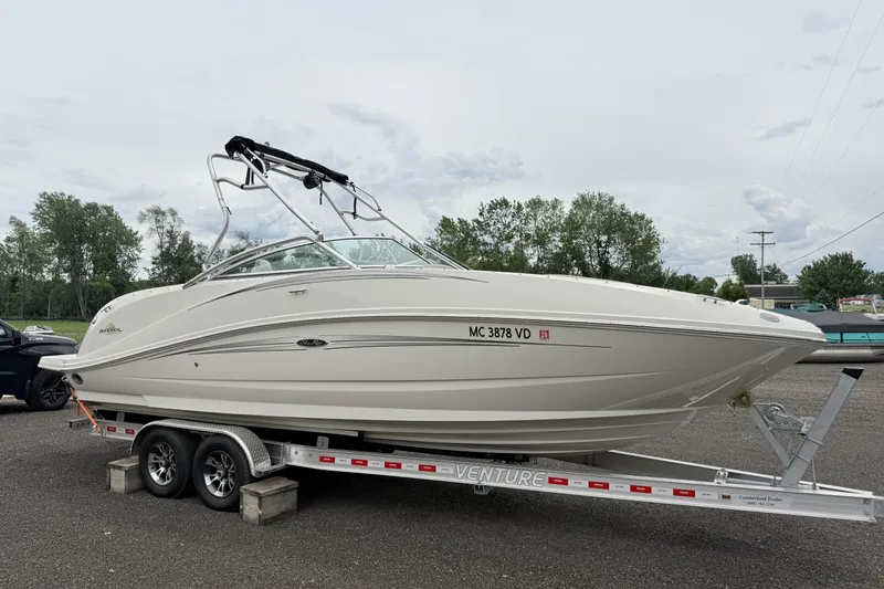 Slide: The Image of 2007 Sea Ray 260 Sundeck boat on trailer, parked outdoors. - 8