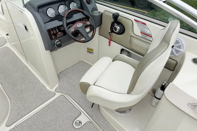 Slide: The Image of Captain's seat and helm of a 2007 Sea Ray 260 Sundeck boat. - 6