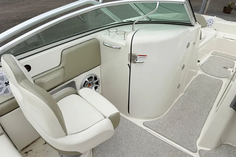 Slide: The Image of 2007 Sea Ray 260 Sundeck interior with seating and storage compartments. - 7