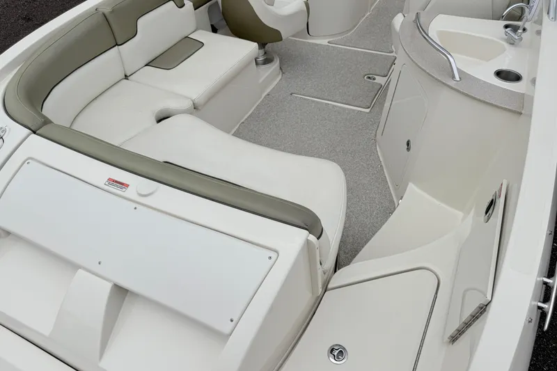 Slide: The Image of 2007 Sea Ray 260 Sundeck interior with seating and sink area. - 15