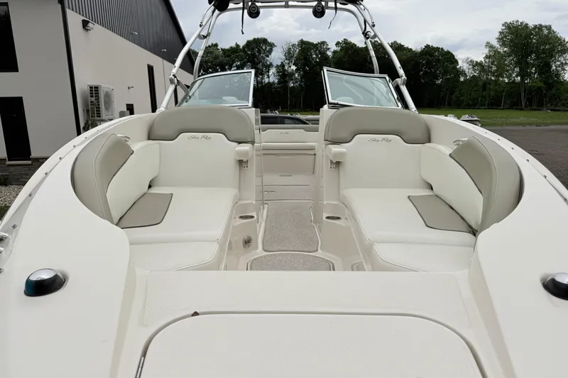 Slide: The Image of 2007 Sea Ray 260 Sundeck boat interior with spacious seating and open deck layout. - 9