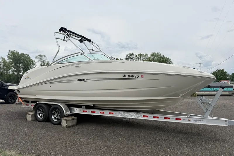 Slide: The Image of 2007 Sea Ray 260 Sundeck boat on trailer, parked outdoors. - 3