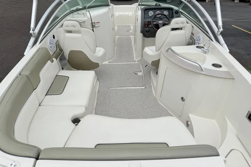 Slide: The Image of 2007 Sea Ray 260 Sundeck interior with spacious seating and modern dashboard. - 14