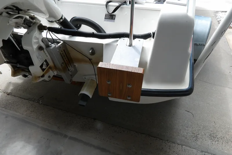 Slide: The Image of 1978 Boston Whaler 21 Revenge boat stern with motor mount and wiring details. - 9