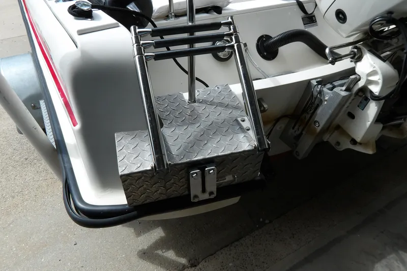 Slide: The Image of 1978 Boston Whaler 21 Revenge boat with metal ladder and diamond plate platform. - 8