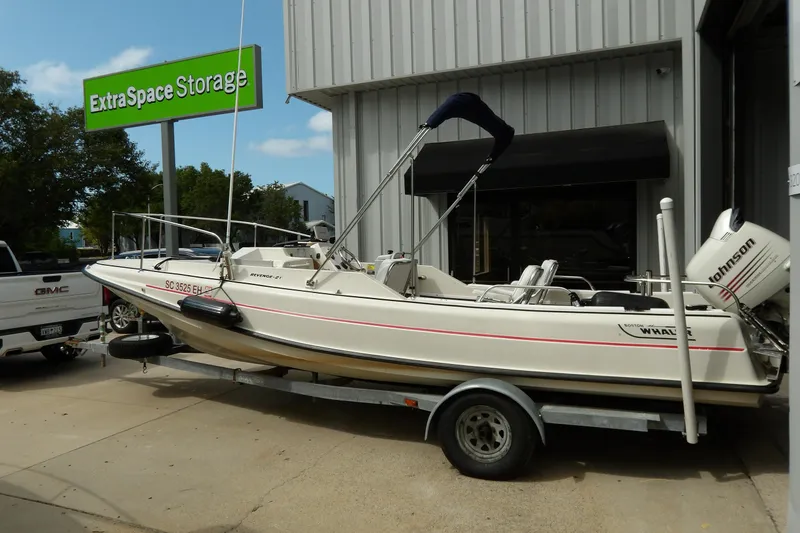 Slide: The Image of 1978 Boston Whaler 21 Revenge boat on trailer near Extra Space Storage facility. - 5
