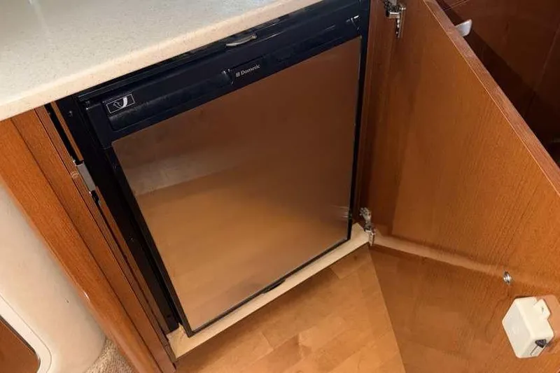 Slide: The Image of Built-in fridge in 2011 Sea Ray Sundancer 370 yacht kitchen area. - 23
