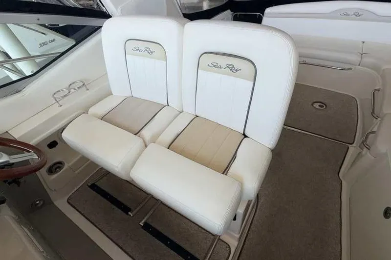 Slide: The Image of Luxury seating on 2011 Sea Ray Sundancer 370 boat, featuring plush white upholstery. - 18