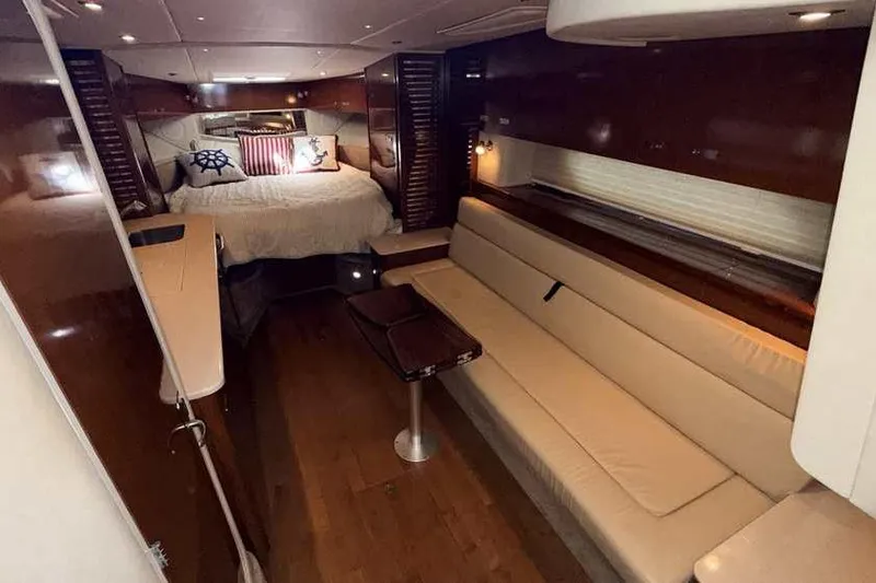 Slide: The Image of Luxurious interior of 2011 Sea Ray Sundancer 370 yacht with cozy seating and elegant wood finishes. - 21