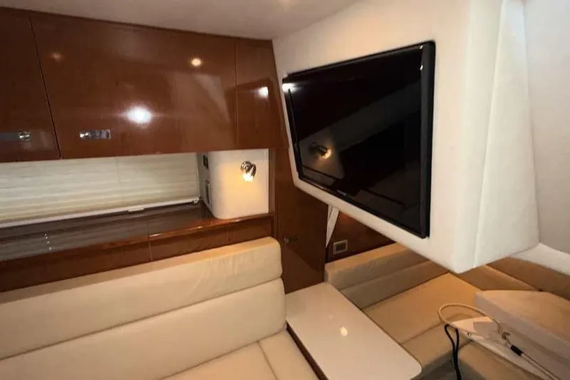Slide: The Image of Interior of 2011 Sea Ray Sundancer 370 yacht with TV and seating area. - 24
