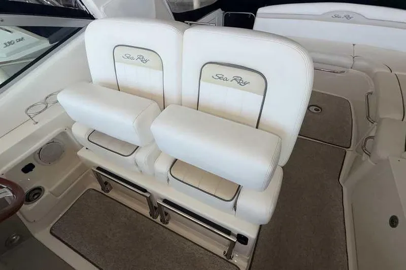 Slide: The Image of Luxury seating on 2011 Sea Ray Sundancer 370 yacht, featuring plush white upholstery. - 19