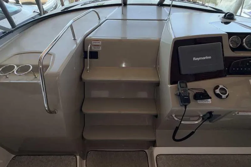 Slide: The Image of Interior helm of 2011 Sea Ray Sundancer 370 with Raymarine navigation system. - 17