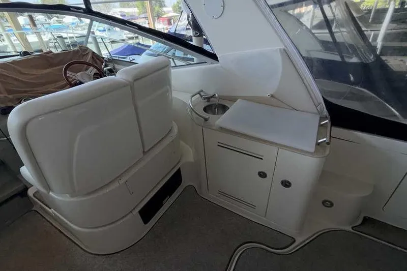 Slide: The Image of Interior of 2011 Sea Ray Sundancer 370 yacht with seating and compact sink area. - 11
