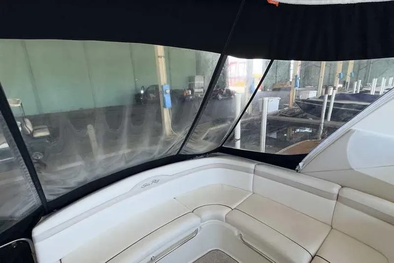 Slide: The Image of Interior view of 2011 Sea Ray Sundancer 370 with cushioned seating and protective canopy. - 9
